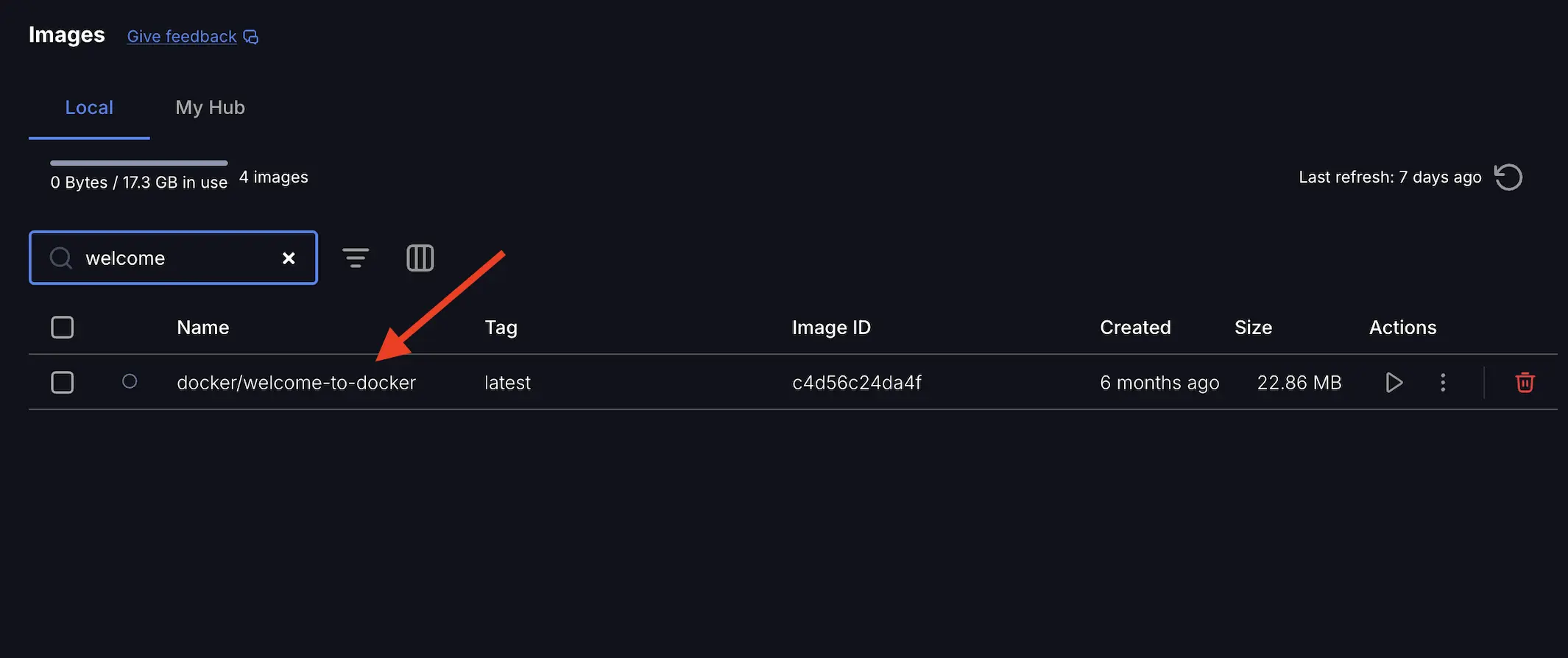 A screenshot of the Docker Desktop Dashboard showing the images view with an arrow pointing to the docker/welcome-to-docker image